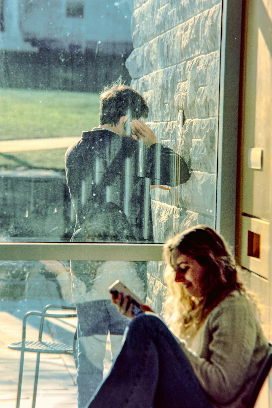 person reading book by window