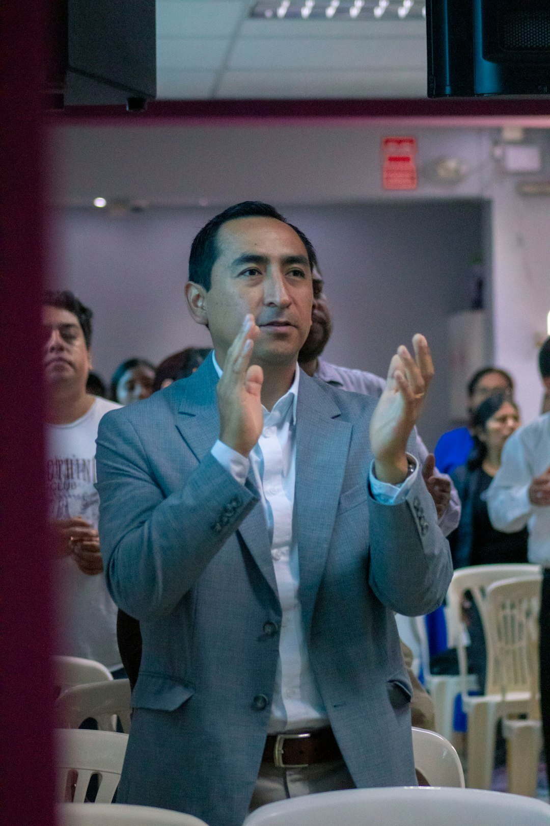 man gesturing while speaking